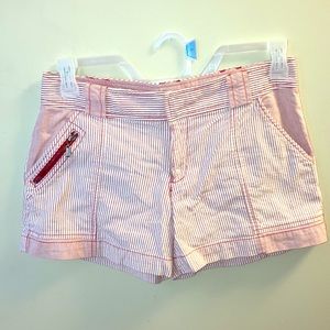 Red and white striped shorts with zippered pockets